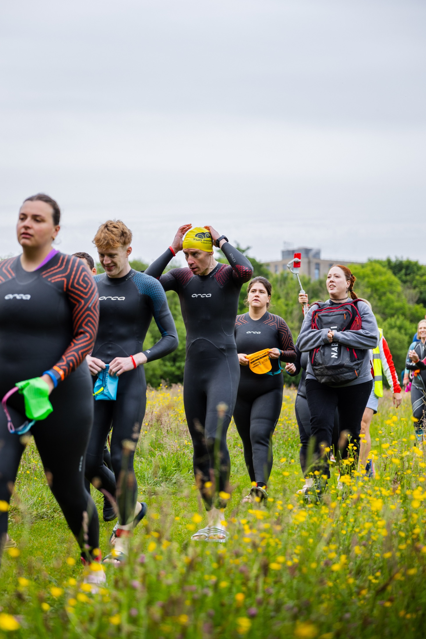 Athletes in wetsuits prepare for the River Corrib swim